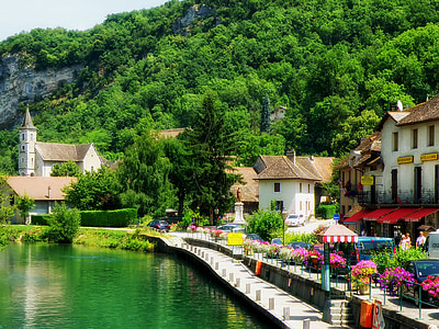 white-and-brown concrete houses beside body of water during daytime thumbnail