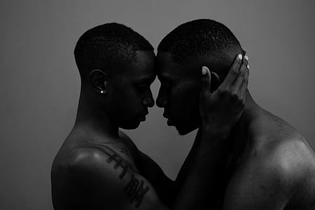 Grayscale Photo of Woman Holding Man Head thumbnail
