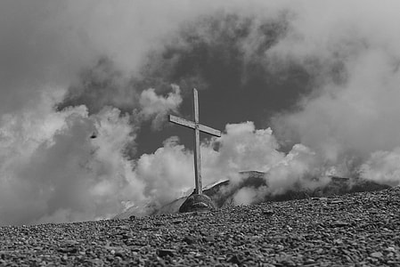 grayscale photo of cross on hill thumbnail
