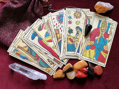 tarrot card beside stone thumbnail