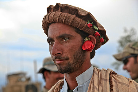 selective focus photography of man wearing brown hat thumbnail