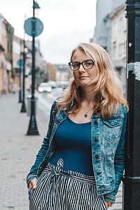 woman standing near post thumbnail