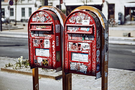 two red-and-white mail boxes thumbnail