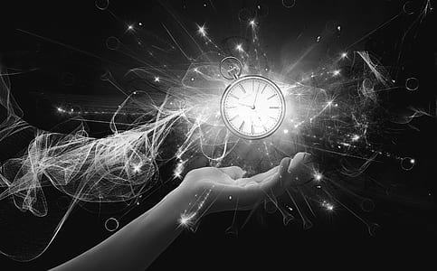 grayscale photo of hand with floating pocket clock striking at 10:08 thumbnail