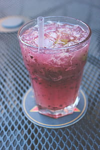 Clear Drinking Glass Filled With Juice thumbnail
