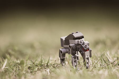 depth of field photography of grey robot toy thumbnail