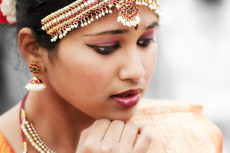 closeup photo of woman putting hand on chin thumbnail