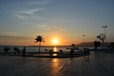 body of water under orange sunset thumbnail