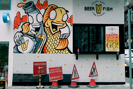 road signs in front of Beer Fish store thumbnail
