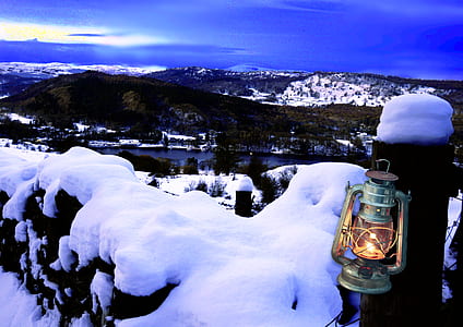 lighted green lantern hanged on post thumbnail