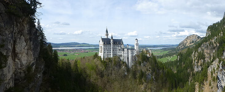 white mansion on green forest during daytime thumbnail