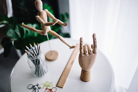 Wooden mannequin in various poses thumbnail