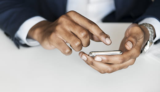 person using smartphone with wearing suit thumbnail