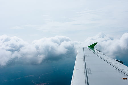 white airplane wings at daytime thumbnail
