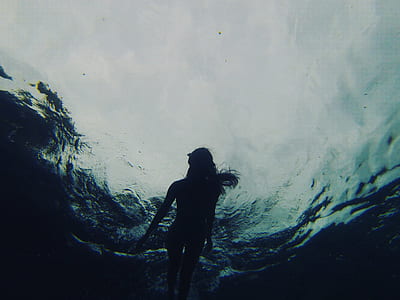 woman swimming under water thumbnail
