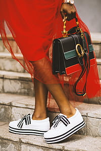 Person Carrying Black Leather Handbag thumbnail