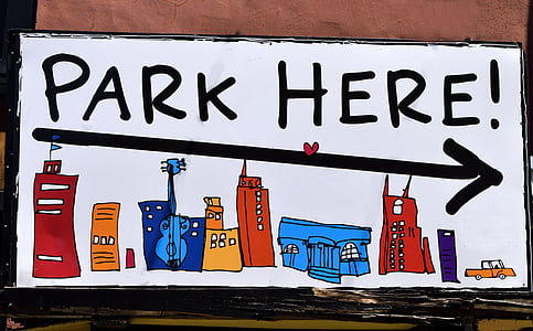 closeup photo of multicolored parking signage thumbnail