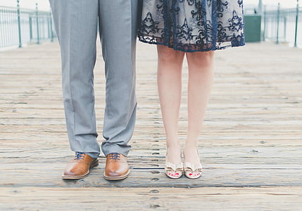 man wears gray pants and brown leather dress shoes thumbnail