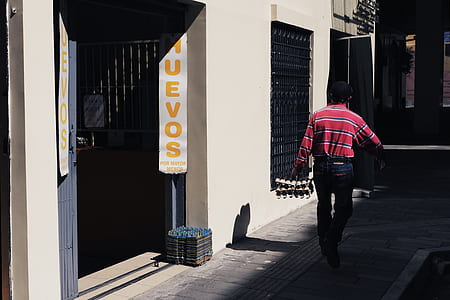 man walking beside hallway thumbnail