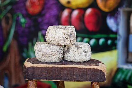 selective focus photography of piled stone on wooden table thumbnail