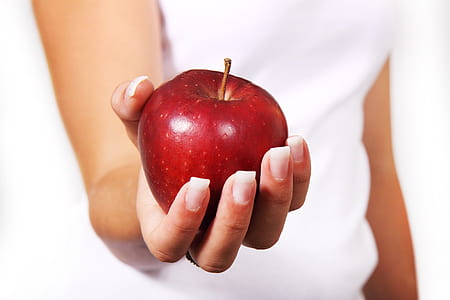 person holding red apple thumbnail