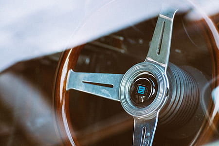 closeup photo of gray and brown vehicle steering wheel thumbnail