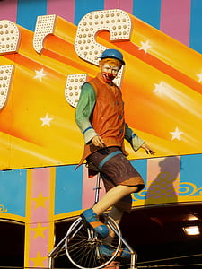 clown riding unicycle thumbnail