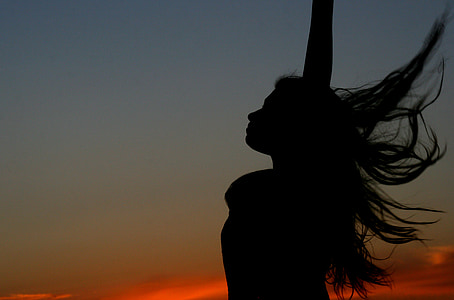 silhouette of woman raising hand thumbnail
