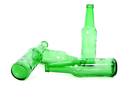four green translucent glass bottles thumbnail