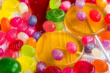 assorted-color candy lot on white surface thumbnail