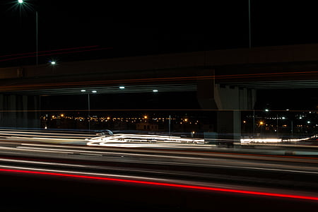 timelapse photography of vehicle lights on road at nighttime thumbnail