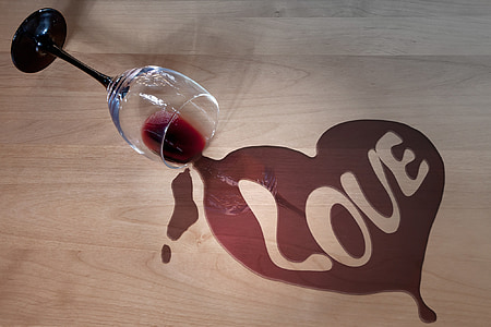 black and clear wine glass showing heart-shaped liquid with love text thumbnail