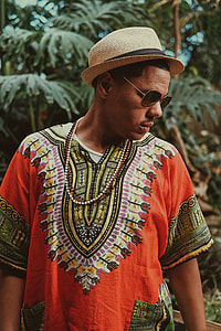 man wearing dashiki shirt  and sunglasses thumbnail