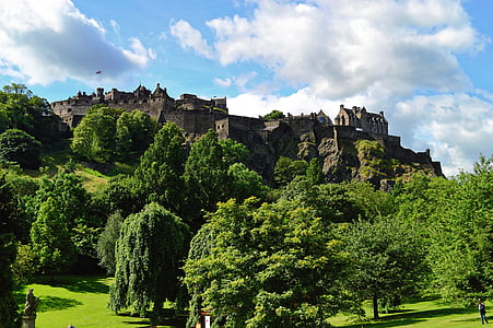 castle under cumulus cloud photograph thumbnail