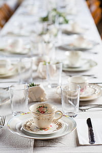 white ceramic teacup on plate thumbnail