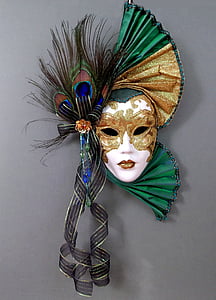 white, brown, and green mask with peacock tails thumbnail