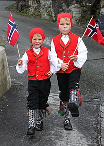 two boy's marching while holding flaglets thumbnail