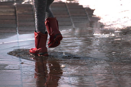 woman wears red rain boots thumbnail