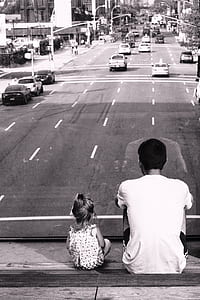 father and daughter sitting on floor thumbnail