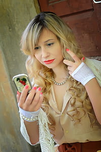 woman looking on the mirror thumbnail