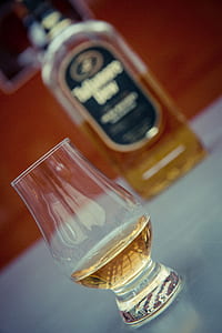 clear drinking glass on white table thumbnail
