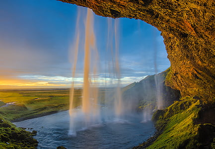waterfall near green field at daytime thumbnail