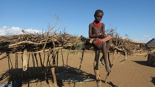 child sitting on brown roof thumbnail