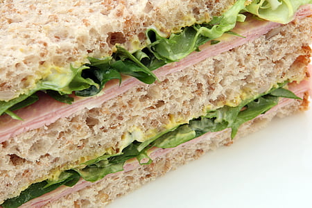 close-up photo of ham sandwich filled with lettuce thumbnail