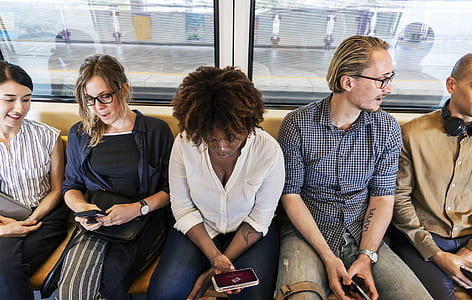 group of people sitting inside train thumbnail