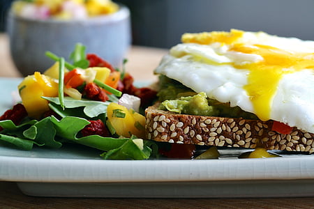 plate of fried egg with bread and salad thumbnail