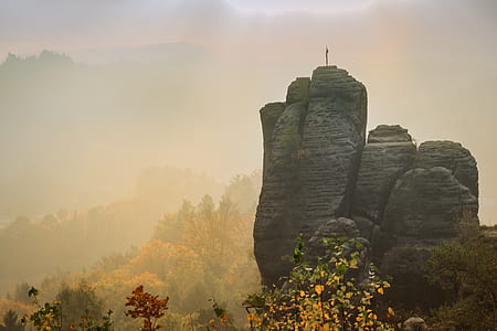 gray mountain surrounded by green trees thumbnail