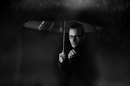 man holding a umbrella thumbnail