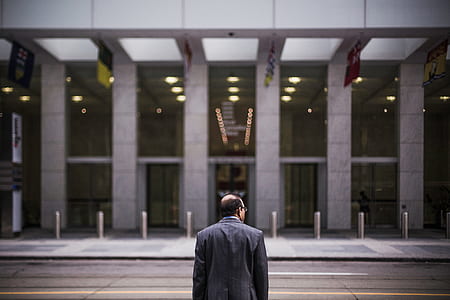 man in black coat in building thumbnail
