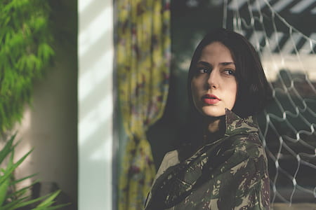 woman wearing camouflage top thumbnail